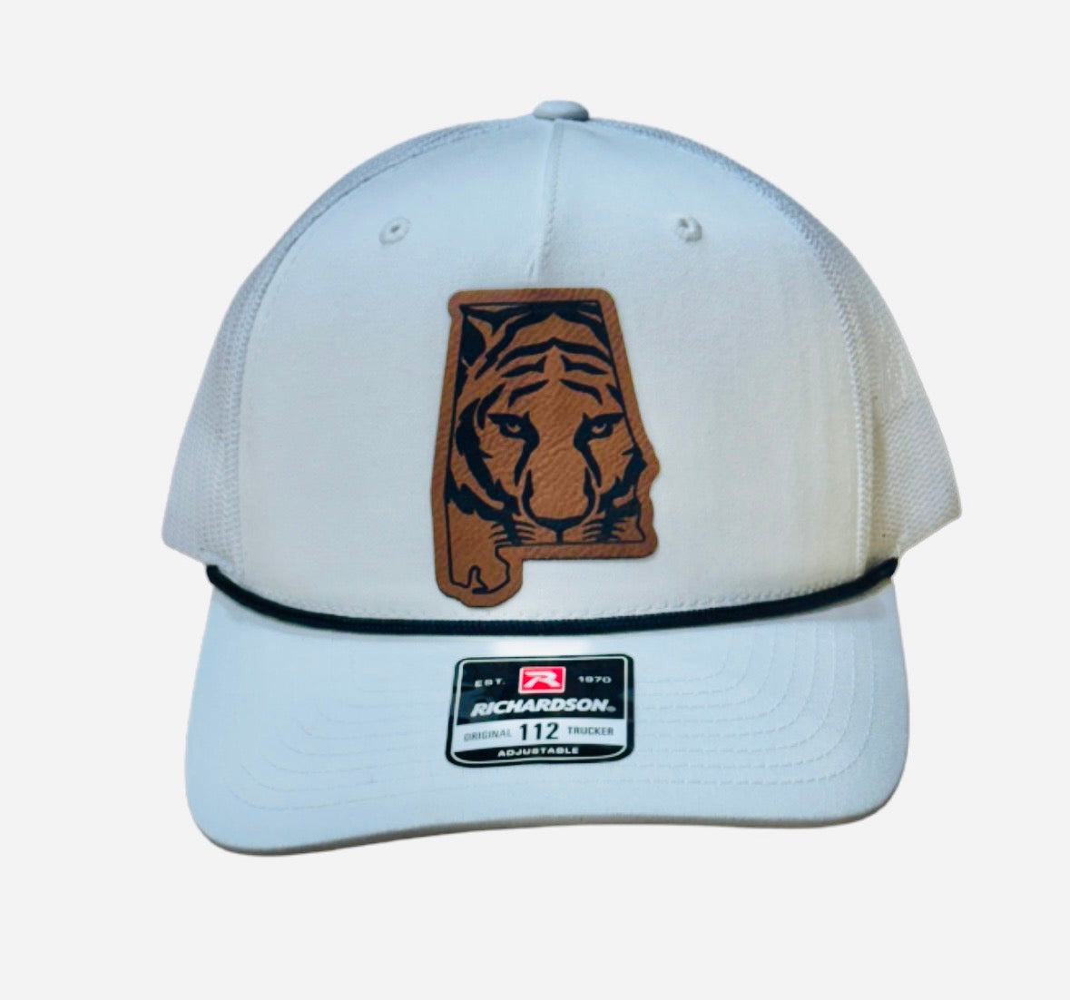 White cap with a tiger logo on a white background